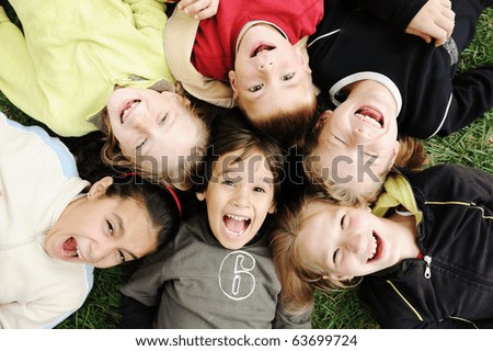Happiness without limit, happy group of children in circle, together outdoor, faces, smiling and careless