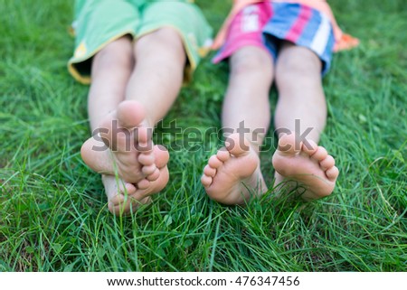 Happy Friends Sitting On Grass Barefoot Stock Photo 96942986 - Shutterstock