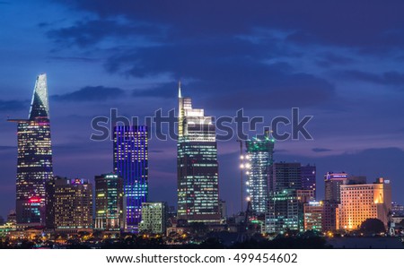 Ho Chi Minh City, Vietnam - OCT 14, 2016: Beautiful dusk over downtown of Ho Chi Minh City beside Saigon river by night, view from Thu Thiem Bridge.