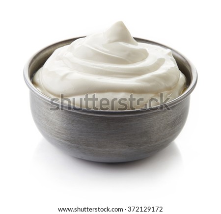 Bowl of cream on white background