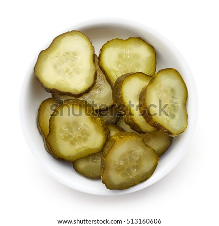 Bowl of chopped pickled cucumber isolated on white, top view