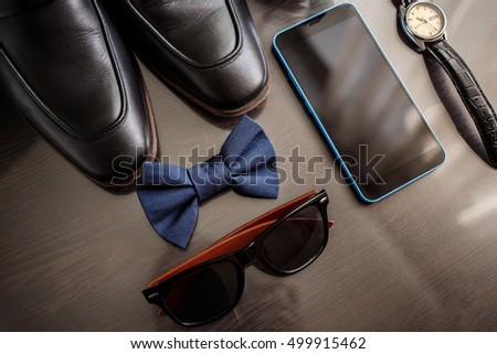 Businessman accessories. Man's style. Men's Accessories : Men's butterfly, Men's shoes , men's watches. Set groom Butterfly shoes Belts Watches, mobile phone. Gadget