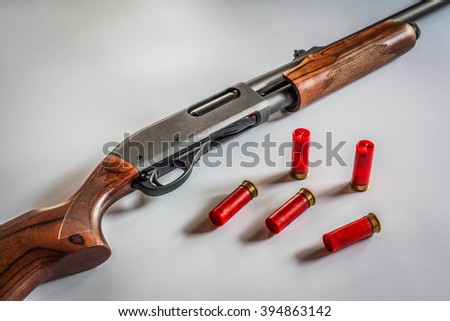 stock-photo-shotgun-with-bullets-394863142.jpg