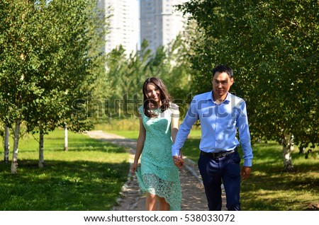 https://thumb9.shutterstock.com/display_pic_with_logo/3978596/538033072/stock-photo-young-happy-asian-couple-walking-in-the-park-538033072.jpg