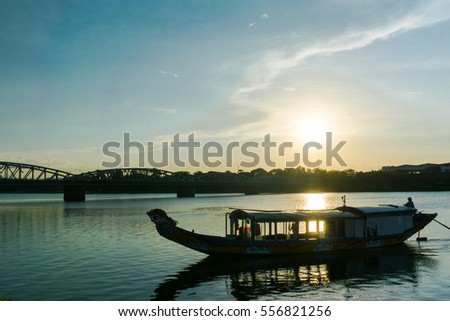 A boat station at Perfume River near Trang Tien bridge in sunset scene, Hue, Vietnam