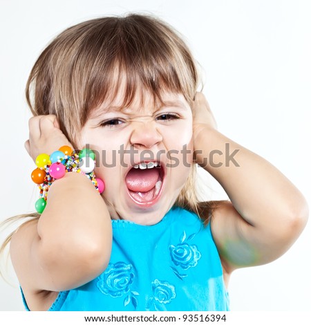Little screaming girl with both eyes closed isolated over white background