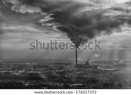 Air pollution smoke from pipes and factory with winter background