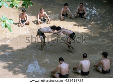BAC GIANG, VIET NAM, May 20, 2016 man team, Van village, Bac Giang, Vietnam. participate in the festival competition ball, traditional materials, on the mud, very unique, the legacy of Vietnam
