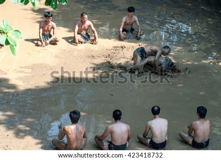 BAC GIANG, VIET NAM, May 20, 2016 man team, Van village, Bac Giang, Vietnam. participate in the festival competition ball, traditional materials, on the mud, very unique, the legacy of Vietnam