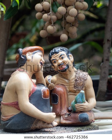 HUNG YEN, VIET NAM, July 29, 2016 the statue, named (Chi Pheo, Thi No). famous Vietnam, sitting, orchard, longan. Countryside Hung Yen, Vietnam
