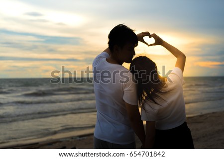 https://thumb9.shutterstock.com/display_pic_with_logo/4078237/654701842/stock-photo-young-man-holding-hand-finger-with-girl-romantic-together-relationship-valentine-lover-day-at-beach-654701842.jpg