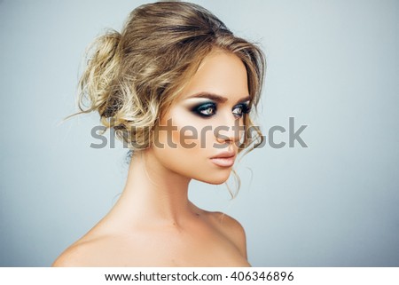 https://thumb9.shutterstock.com/display_pic_with_logo/4078816/406346896/stock-photo-beautiful-young-blond-woman-model-with-art-make-up-on-white-background-in-studio-406346896.jpg