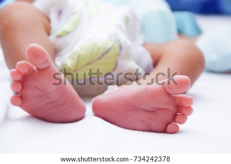 Taking a heel blood sample from newborn baby Taking a heel blood sample from newborn baby