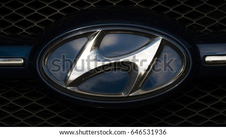 VANTAA, FINLAND, May 21st: A glistening Hyundai Logo on the front of the car.
