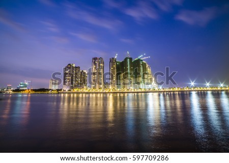 HO CHI MINH, VIET NAM - MAR 11, 2017: Ho Chi Minh city at night, view from a park in district 2, Sai Gon, Viet Nam.