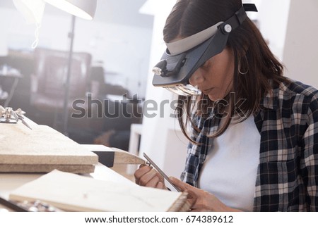 Jeweler at work, crafting in a jewelry workshop.