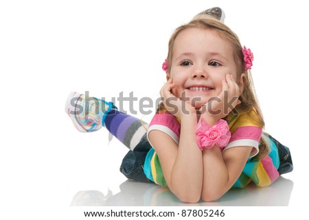 A smiling little girl is looking away; isolated on the white background