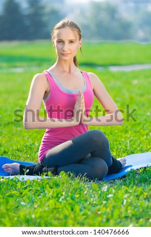 https://thumb9.shutterstock.com/display_pic_with_logo/422893/140476666/stock-photo-beautiful-sport-woman-doing-stretching-fitness-exercise-in-city-park-at-green-grass-yoga-postures-140476666.jpg