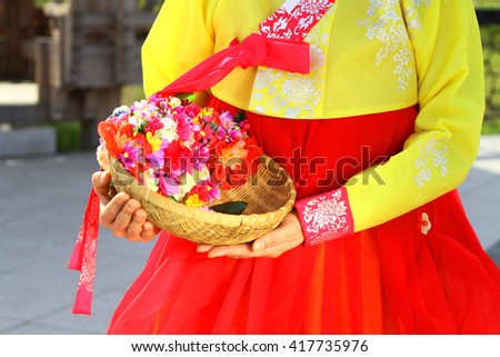 http://thumb9.shutterstock.com/display_pic_with_logo/4241725/417735976/stock-photo-the-woman-wearing-hanbok-korean-traditional-dress-and-holding-a-flower-basket-417735976.jpg