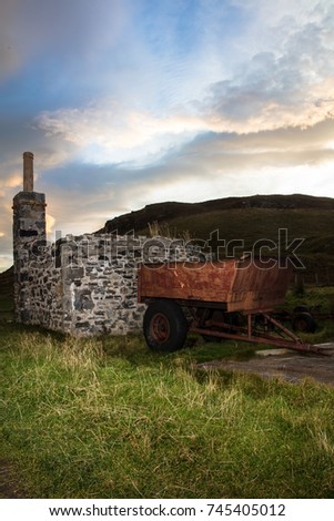 Sunrise Over The Hill With Old Farm Trailer And Ruined Stone House Chimney Sunrise Over The Hill With Old Farm Trailer And Ruined Stone House Chimney