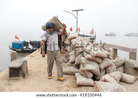 HAI PHONG, VIETNAM April 12 2016 Fishermen are transporting construction materials on Hon Dau Island.this is one of the most beautiful island and there are many tourists in Hai Phong,VIetnam