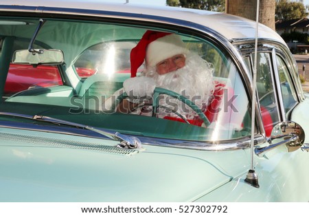 Santa Claus arrives in style in his Classic Car. Santa loves to deliver presents in his car when his Reindeer are tired. Santa Drives