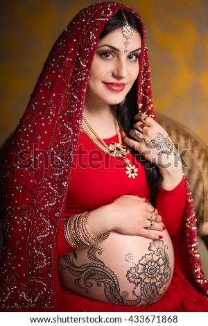 Traditional Wedding Background stock photo a pregnant indian woman in a red saree mehendi saree india 433671868 - Traditional Wedding Background