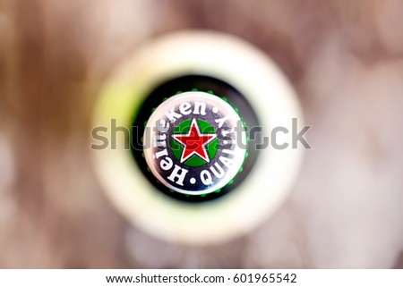 DORKOVO, BULGARIA - MARCH 13, 2017: Macro shot of Heineken bouttle flat lay view from above..Heineken Lager Beer is the flagship product of Heineken International
