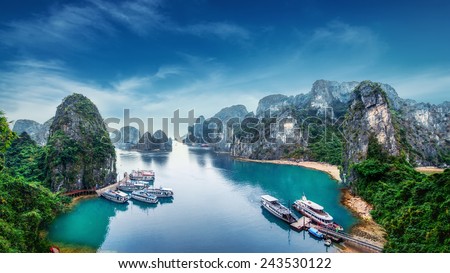 Tourist junks floating among limestone rocks at Ha Long Bay, South China Sea, Vietnam, Southeast Asia