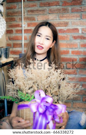 The Olw,Pak Khat,Bueng Kan,Thailand-2017-06-05 : A Sexy woman wearing black Calvin Klein sport bra and chanel Necklace in coffee shop.