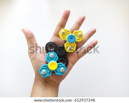 Male Hand Holding Popular Fid Spinner Stock