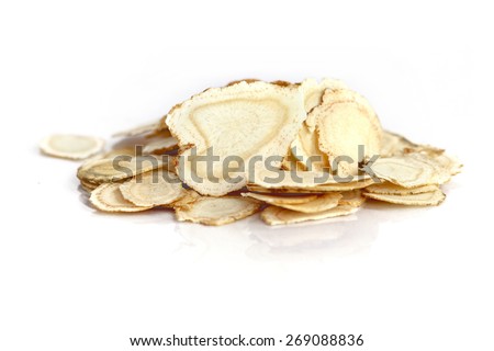 Chinese Herbal medicine - American Ginseng slices (Panax quinquefolius) on white background (manual focus)