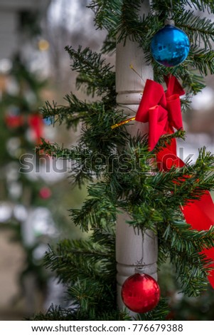 rad bow tie christmas ornaments and evergreen decoration hang on the wood column traditional - How To Tie Decorative Bows For Christmas Decor rad bow tie christmas ornaments and evergreen decoration hang on the wood column traditional - How To Tie Decorative Bows For Christmas Decor