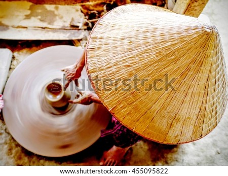 Potter at work on a pottery wheel. Duy Tan village, Hoi An, Vietnam