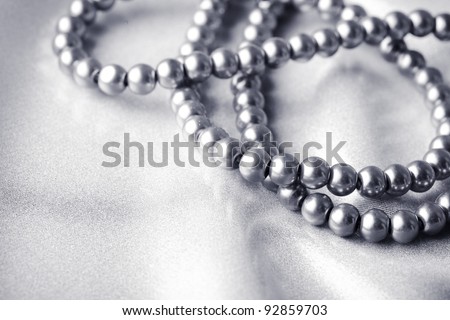 Background from beads on silk textile
