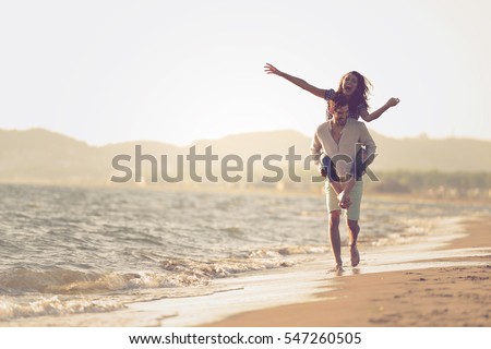 [fb] les angélus // jola&monsiame Stock-photo-a-guy-carrying-a-girl-on-his-back-at-the-beach-outdoors-547260505