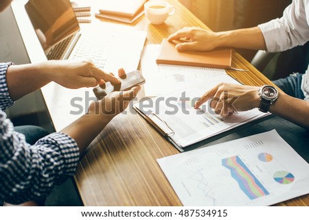 Hand Pointing Business Document During Discussion Imagen 