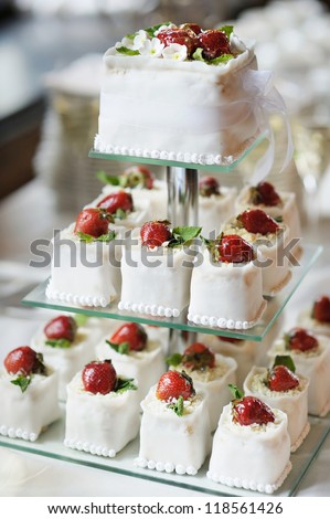 Delicious fancy wedding cake made of cupcakes - stock photo