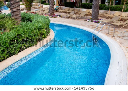 residential inground swimming pool backyard waterfall