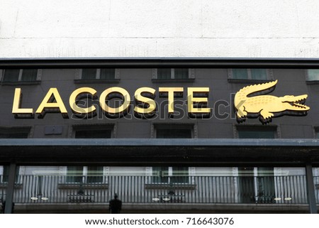 Budapest, Hungary, September 13, 2017: Lacoste sign on a store. Lacoste is a French clothing company that sells high-end clothing, footwear, perfume, leather goods, and most famously polo shirts