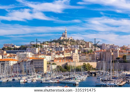 stock-photo-aerial-panoramic-view-on-basilica-of-notre-dame-de-la-garde-and-old-port-in-marseille-france-335191475.jpg