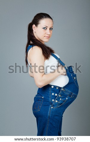stock photo portrait of pregnant brunette woman on grey background young pregnant girl 93938707