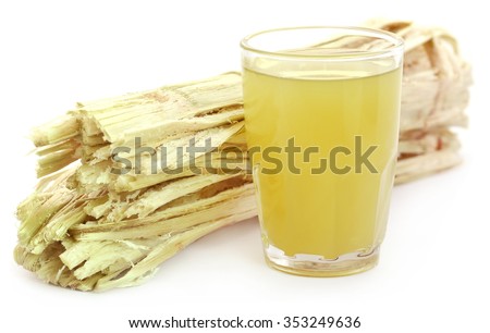 Sugarcane juice with bagasse over white background