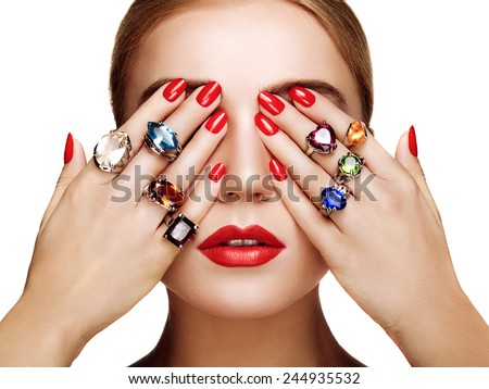 Portrait of beautiful woman with jewelry. Manicure and makeup. Perfect skin. Fashion beauty. Ring. Blonde girl. Close up