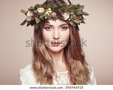 https://thumb9.shutterstock.com/display_pic_with_logo/493354/396946918/stock-photo-beautiful-blonde-woman-with-flower-wreath-on-her-head-beauty-girl-with-flowers-hairstyle-perfect-396946918.jpg