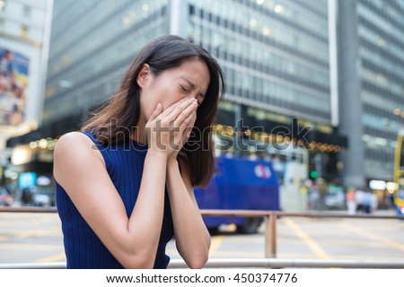 Woman suffer from nose allergy due to air pollution