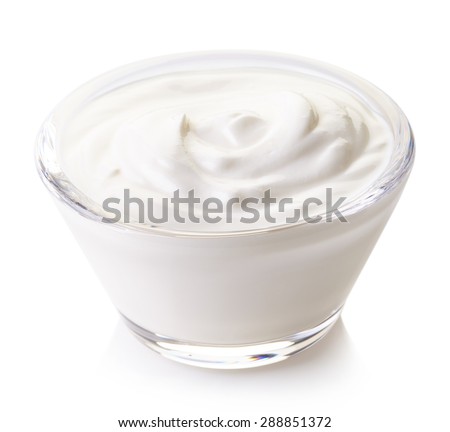 Bowl of sour cream isolated on white background