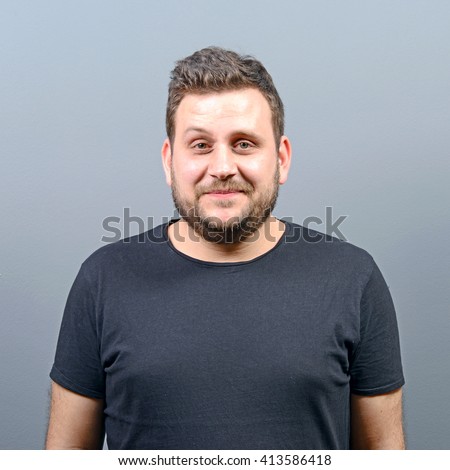 Portrait Chubby Young Man Against Gray Stock Photo 