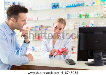 Pharmacist and client at pharmacy
