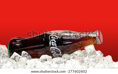 ANKARA - TURKEY - May 10, 2015 Editorial photo of 250ml Classic Coca-Cola bottle with ice on red background. Coca-Cola Company is the most popular market leader in Turkey.